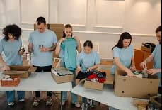 Volunteers sorting donated pet supplies