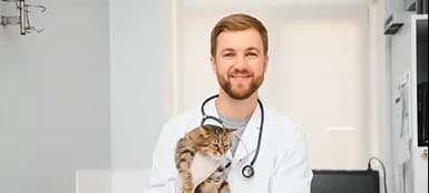 Dr. Marcus Johnson holding a kitten