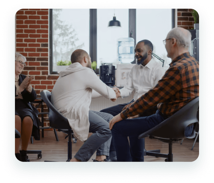 People shaking hands in a strong partnership meeting