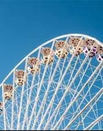 A Ferris wheel against a blue sky