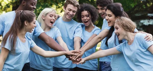 Community volunteers joining hands
