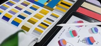 Colour swatches and a sketchbook of painted shapes