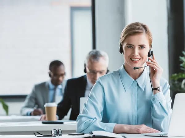 Support agent smiling on a call